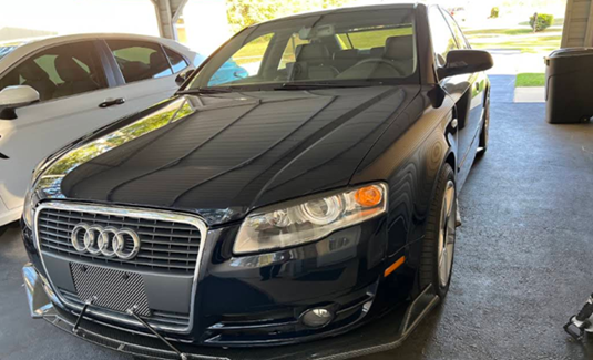 Audi A4 B7 Featuring a Black Aftermarket Front Splitter with Support Rods